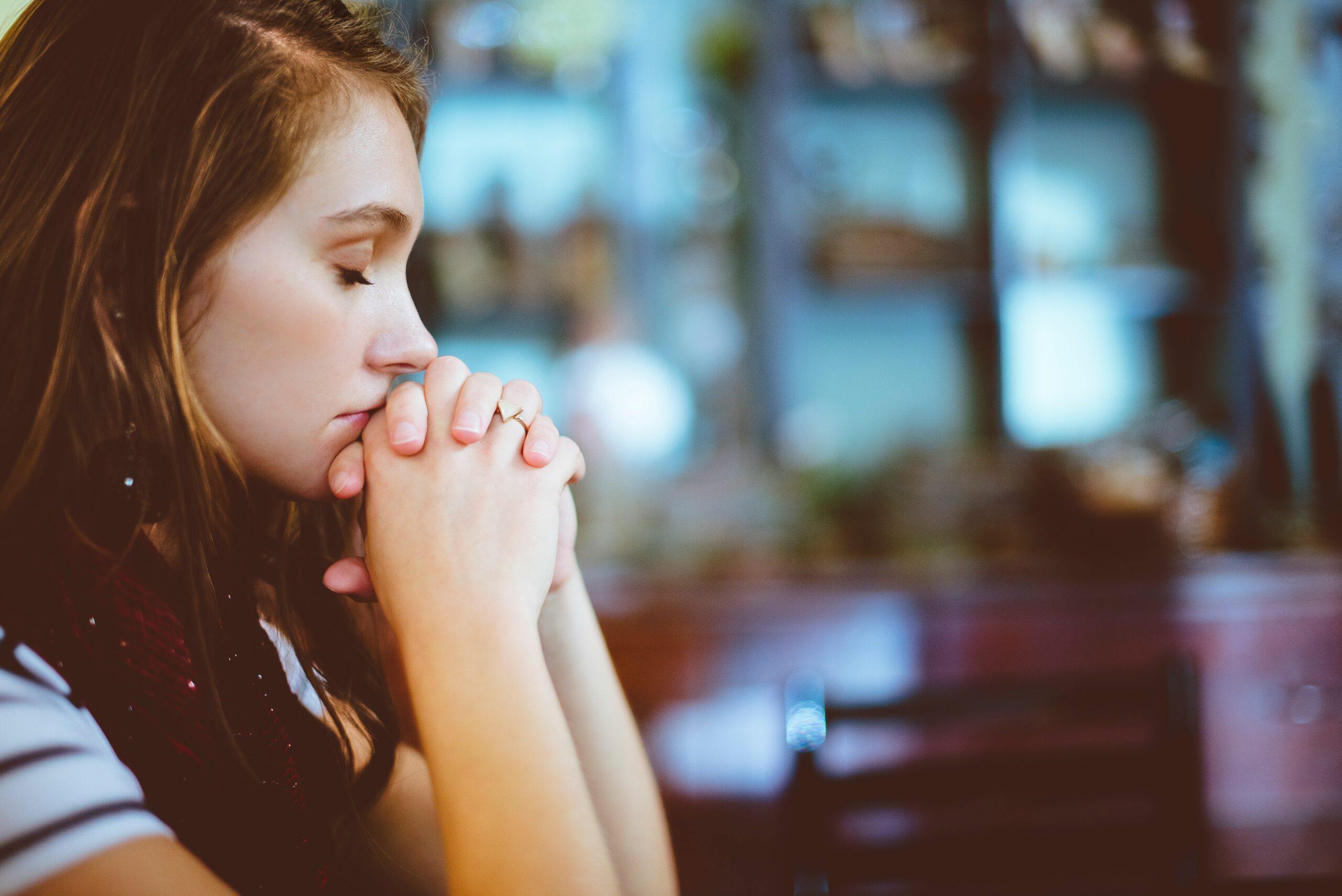 The power of prayer strengthens your relationship with God as a woman prays with faith and trust.