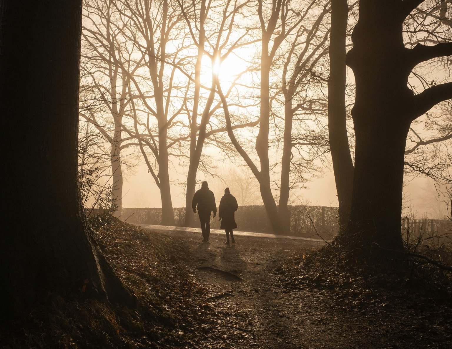 A couple walking by faith on a misty path trusting God before you understand